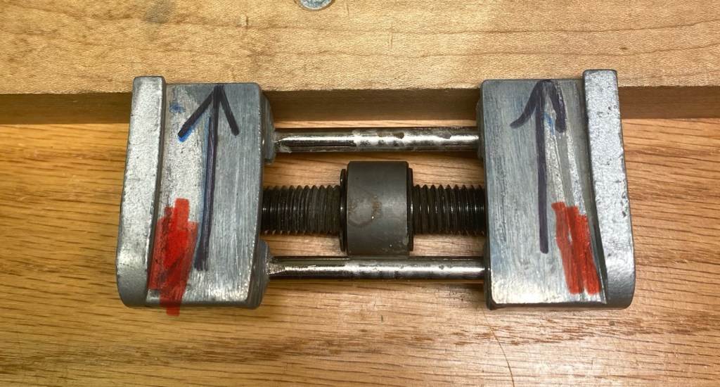 Modified Eclipse-style sharpening jig with filed ears highlighted in red for use with tapered Japanese plane blades